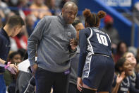 Georgetown head coach James Howard, left, talks with Kennedy Fauntleroy (10) in the second half of an NCAA college basketball game against UConn, Sunday, Jan. 15, 2023, in Hartford, Conn. (AP Photo/Jessica Hill)