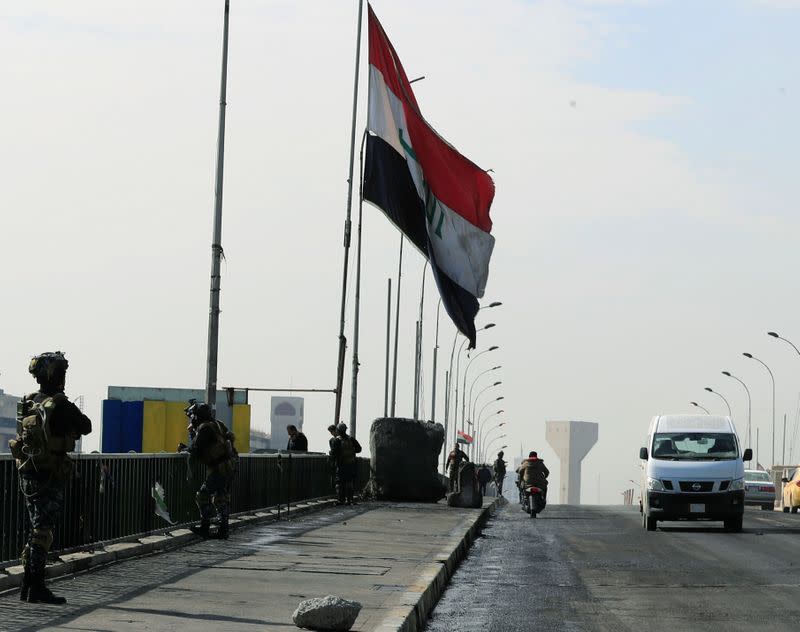 Iraqi security forces re-open BaghdadÕs Sinak bridge, after it was shut down by protesters, in Baghdad