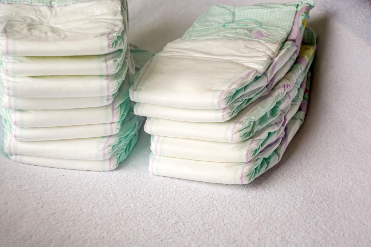 Two stacks of baby diapers