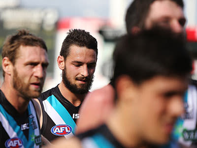 John Butcher of the Power comes from the field at half-time during the round nine AFL match between Port Adelaide Power and the Geelong Cats at AAMI Stadium on May 25, 2013 in Adelaide, Australia.