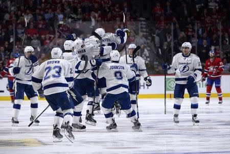 May 1, 2015; Montreal, Quebec, CAN; Tampa Bay Lightning forward Nikita Kucherov (86) celebrates with teammates after scoring the winning goal against the Montreal Canadiens during the second overtime period in game two of the second round of the 2015 Stanley Cup Playoffs at the Bell Centre. Mandatory Credit: Eric Bolte-USA TODAY Sports