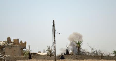 Smoke rises from clashes with Islamic State militants at Shuhadaa neighborhood in Falluja, Iraq, in this picture taken June 5, 2016. REUTERS/Stringer