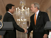 FILE - Then U.S. President George W. Bush, right, shakes hands with then Pakistan President Gen. Pervez Musharraf, on Sept. 22, 2006, at the end of a joint press conference in the East Room at the White House in Washington. Gen. Musharraf, who seized power in a bloodless coup and later led a reluctant Pakistan into aiding the U.S. war in Afghanistan against the Taliban, has died, an official said Sunday, Feb. 5, 2023. He was 79. (AP Photo/Gerald Herbert, File)