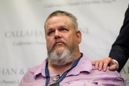 Geoffrey Johnson reacts during the news conference announcing a lawsuit against his former lawyer Michael Avenatti over a 4 million dollar settlement with the County of Los Angeles in Santa Ana