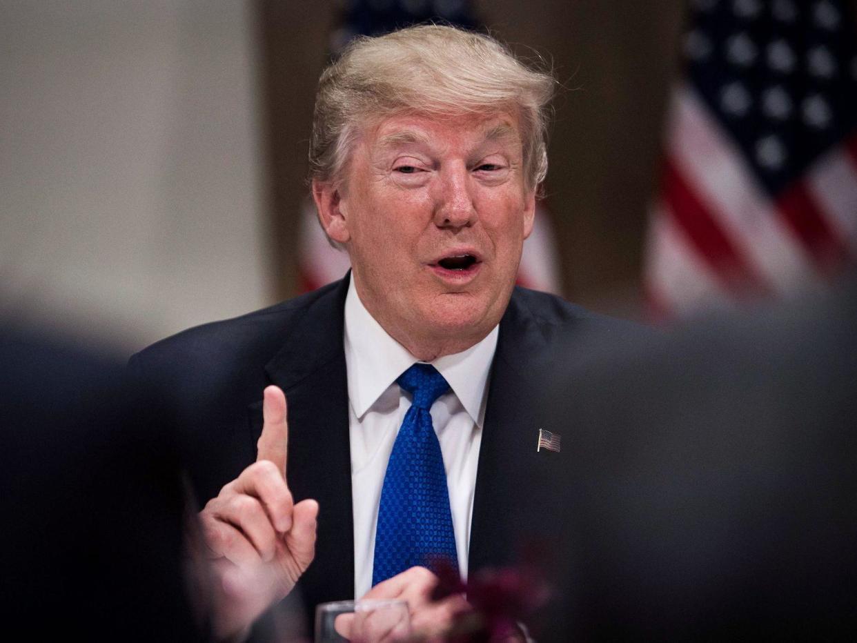 US President Donald Trump gestures as he speaks during a working dinner with European business leaders during the World Economic Forum (WEF) annual meeting in Davos: NICHOLAS KAMM/AFP via Getty Images