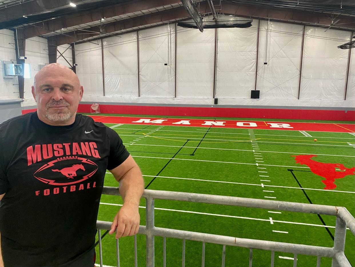 James Keller, overlooking his school's new indoor practice facility on May 7, 2024, is preparing for his fifth year as Manor's head coach. He started to coach after playing football at UTEP.