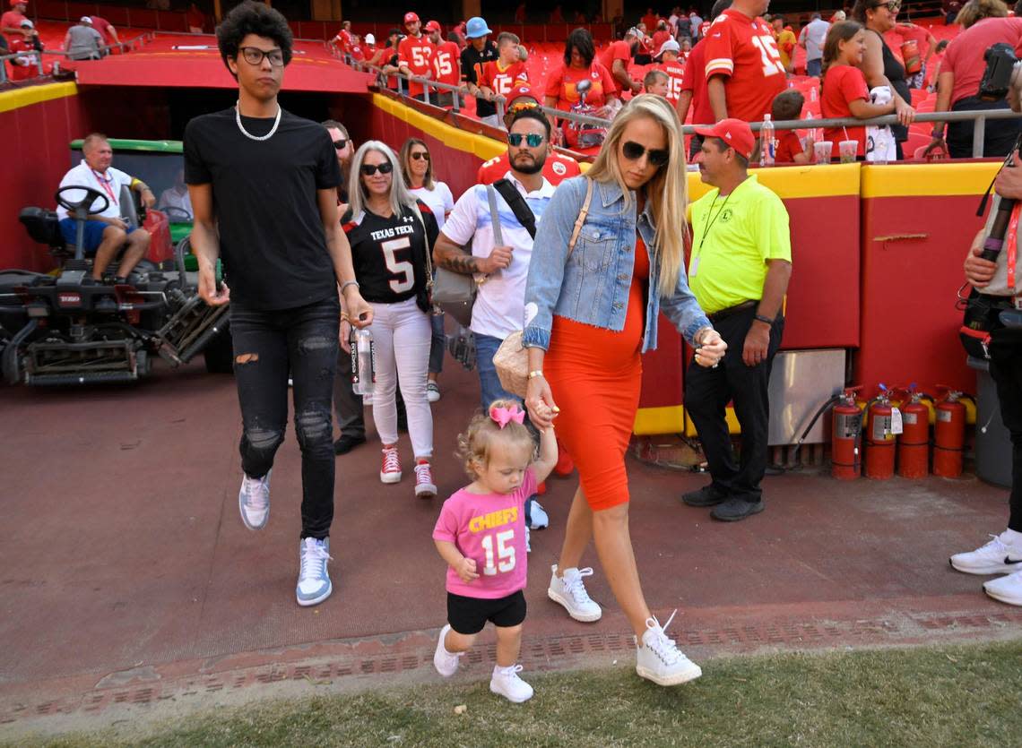 Family members of Kansas City Chiefs quarterback Patrick Mahomes, including brother Jackson Mahomes, wife Brittany Mahomes and daughter, Sterling, headed to the field after the Chiefs defeated the Washington Commanders in August at Arrowhead Stadium.
