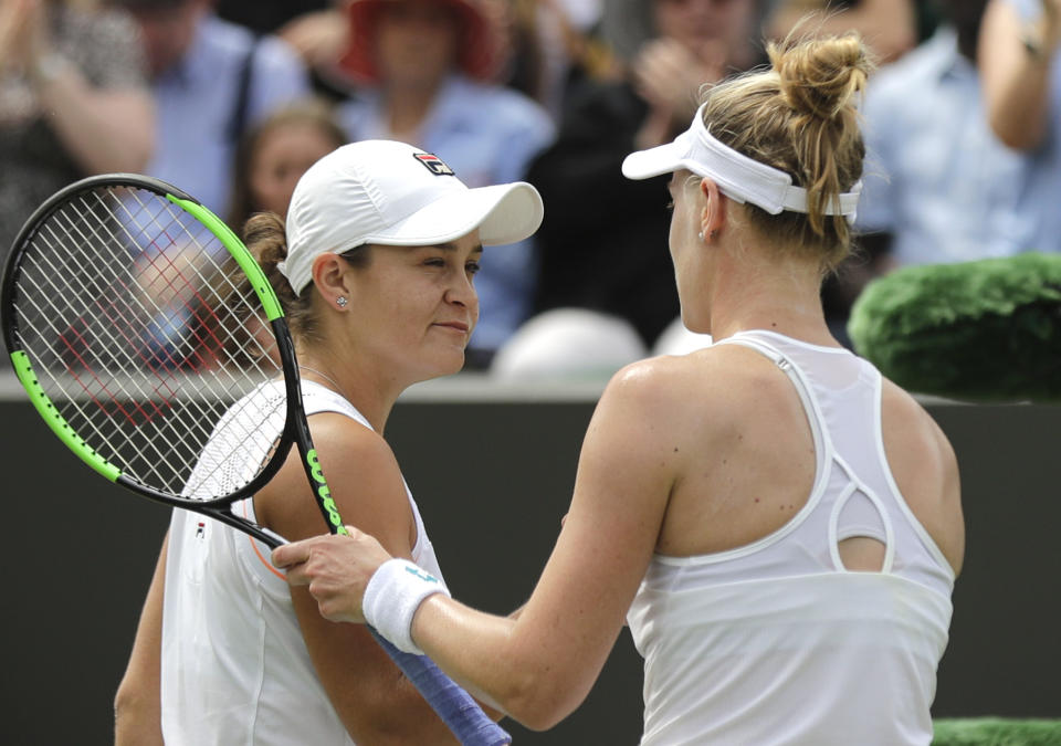 United States' Alison Riske shakes hands with Australia's Ashleigh Barty, left, after defeating her in a women's singles match during day seven of the Wimbledon Tennis Championships in London, Monday, July 8, 2019. (AP Photo/Ben Curtis)