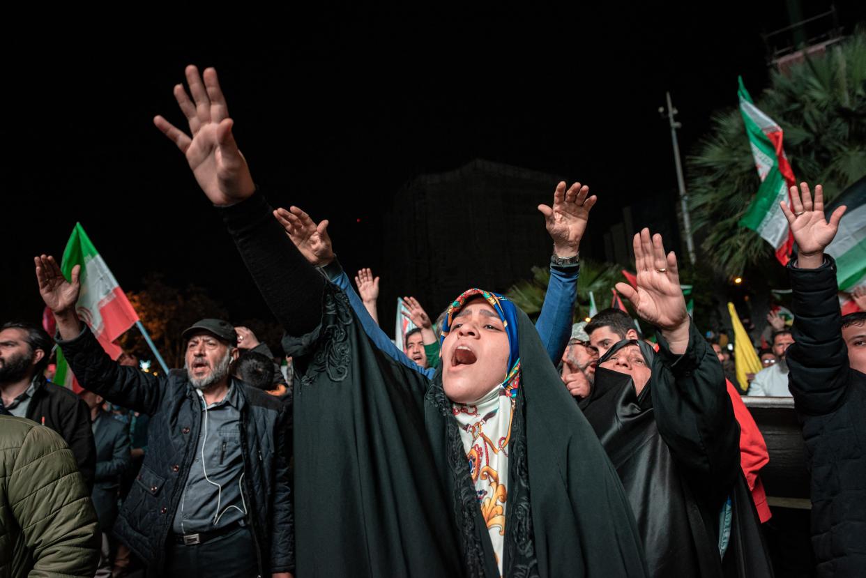 Iranian pro-government supporters shout anti-Israel slogans at Palestine Square in Tehran, on April 14, 2024, in a celebration of the early morning attack on Israel.