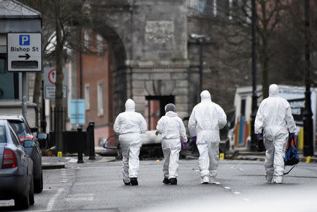 Forensic officers arrive at the scene of a suspected car bomb in Londonderry, Northern Ireland January 20, 2019. REUTERS/Clodagh Kilcoyne