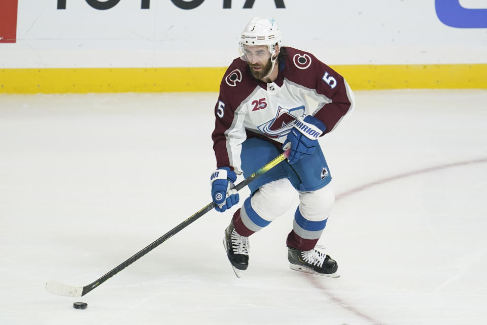 FILE - In this Jan. 21, 2021, file photo, Colorado Avalanche defenseman Greg Pateryn (5) controls the puck during the second period of an NHL hockey game against the Los Angeles Kings in Los Angeles. The Colorado Avalanche acquired goaltender Devan Dubynk from the San Jose Sharks on Saturday, April 10, 2021, in exchange for defenseman Greg Pateryn and a fifth-round pick in the 2021 draft. (AP Photo/Ashley Landis, File)