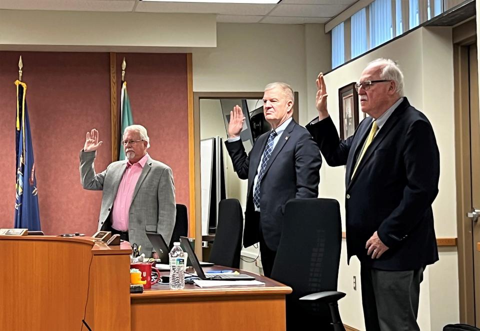 Allegan County commissioners Mark DeYoung (left), Dean Kapenga (center) and Jim Storey (right) take the oath of office Tuesday, Jan. 5, 2023.