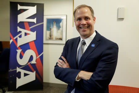 FILE PHOTO: NASA Administrator Jim Bridenstine poses for a photographer after an interview with Reuters at NASA headquarters in Washington, U.S., August 21, 2018. REUTERS/Yuri Gripas/File Photo