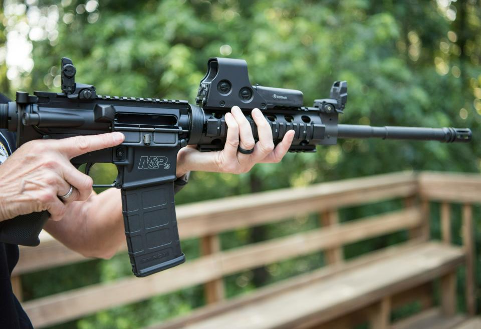 In this June 24, 2016 photo, an AR-15 is held in Auburn, Ga. (AP Photo/Lisa Marie Pane, File)