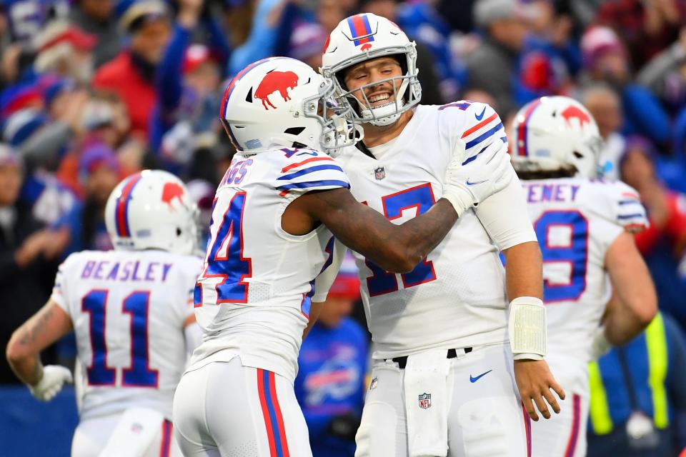 Buffalo Bills wide receiver Stefon Diggs (14) celebrates his touchdown catch with quarterback Josh Allen (17) against the Miami Dolphins in 2021 at Highmark Stadium.