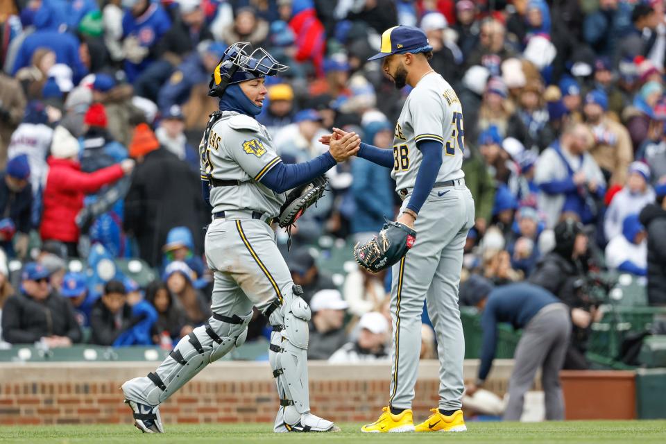 Brewers relief pitcher Devin Williams celebrates with catcher William Contreras after a win.