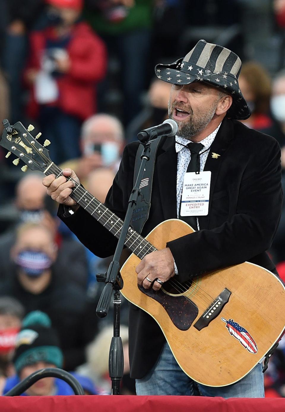 Jake Banta performs the national anthem on Oct. 20, 2020, on the tarmac at Erie International Airport in Millcreek Township during a campaign rally for President Donald Trump.