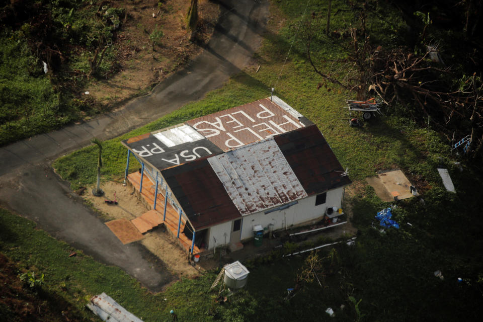 <p>A message written on top of a building is seen from the air during recovery efforts following Hurricane Maria near Humacao, Puerto Rico, Oct.10, 2017. (Photo: Lucas Jackson/Reuters) </p>