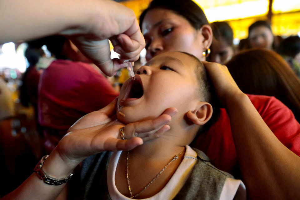 A child receives free polio vaccine during a government-led mass vaccination program in Quezon City, Metro Manila, Philippines, October 14, 2019. REUTERS/Eloisa Lopez