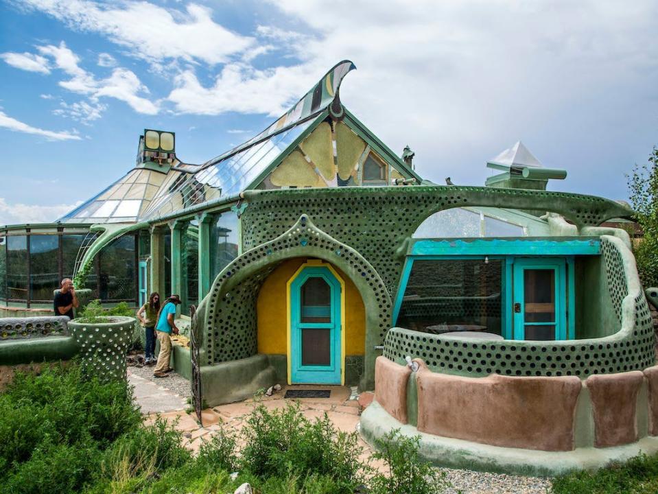 blue and green earthship in new mexico