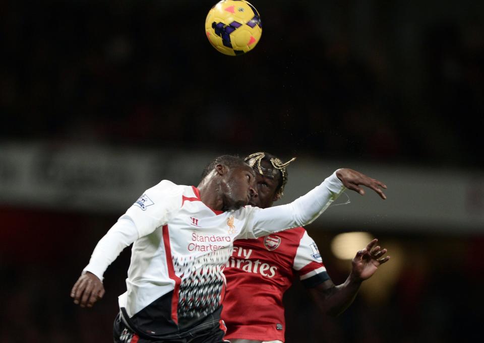 Arsenal's Sagna challenges Liverpool's Cissokho during their English Premier League soccer match at the Emirates stadium in London