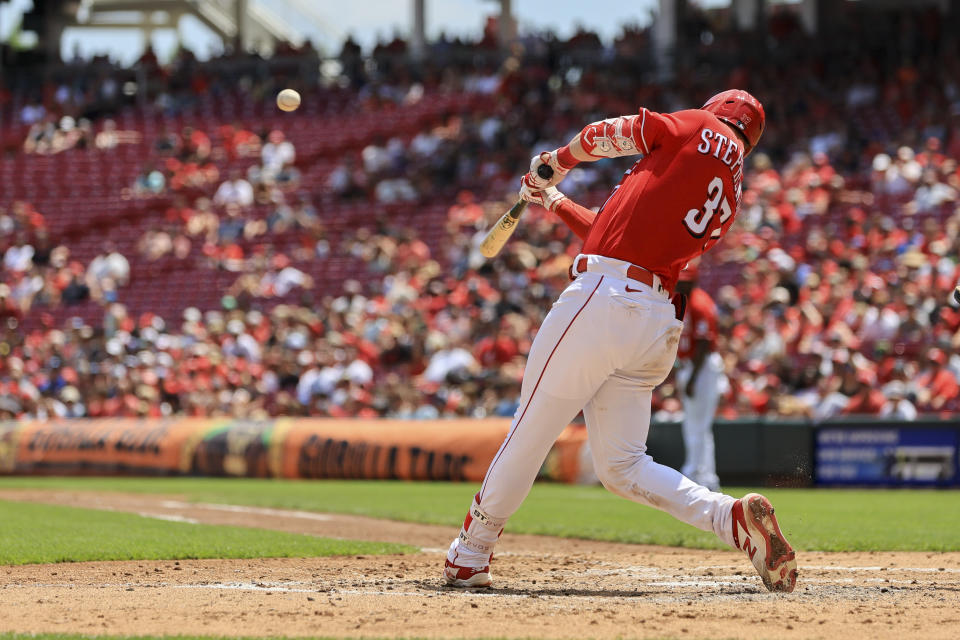 Cincinnati Reds' Tyler Stephenson hits a two-run home run during the third inning of a baseball game against the Tampa Bay Rays in Cincinnati, Sunday, July 10, 2022. (AP Photo/Aaron Doster)