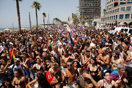 Revellers take part in a gay pride parade in Tel Aviv, Israel June 8, 2018. REUTERS/Corinna Kern