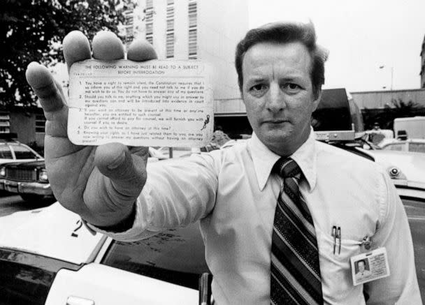 PHOTO: Commander Ralph Page demonstrates a Miranda card, as law enforcement officers throughout the country must do on making an arrest, Nov. 16, 1976. (Robert Houston/AP, FILE)