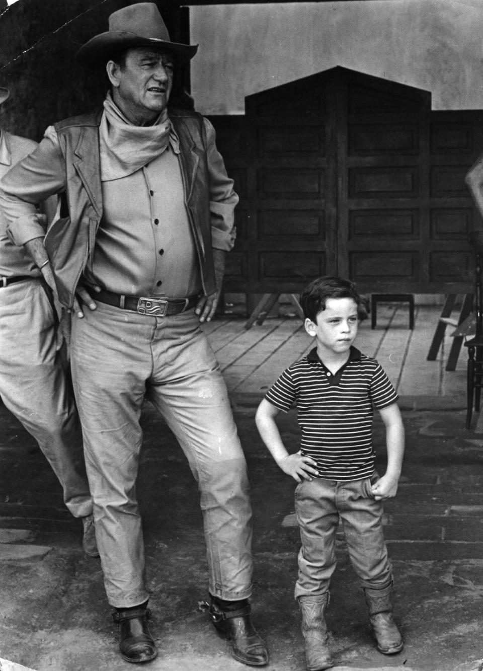 <p>Clearly, John Wayne's son picked up a thing or two from his father about being a cowboy after visiting sets like <em>War Wagon </em>during his childhood. Just look at that expert pose!</p>