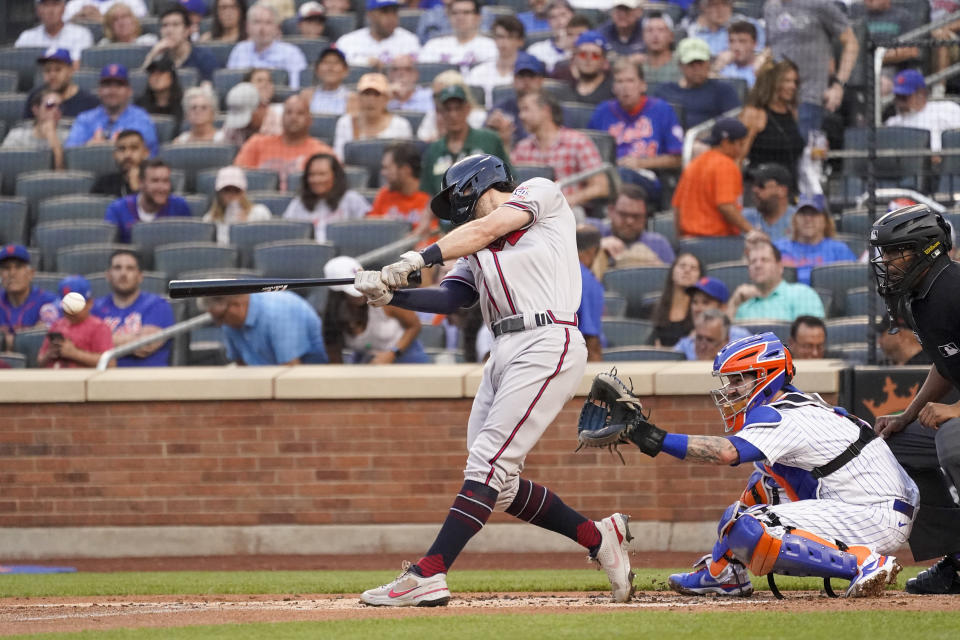 Atlanta Braves' Dansby Swanson hits a two-run double in the first inning of a baseball game against the New York Mets, Tuesday, July 27, 2021, in New York. (AP Photo/Mary Altaffer)