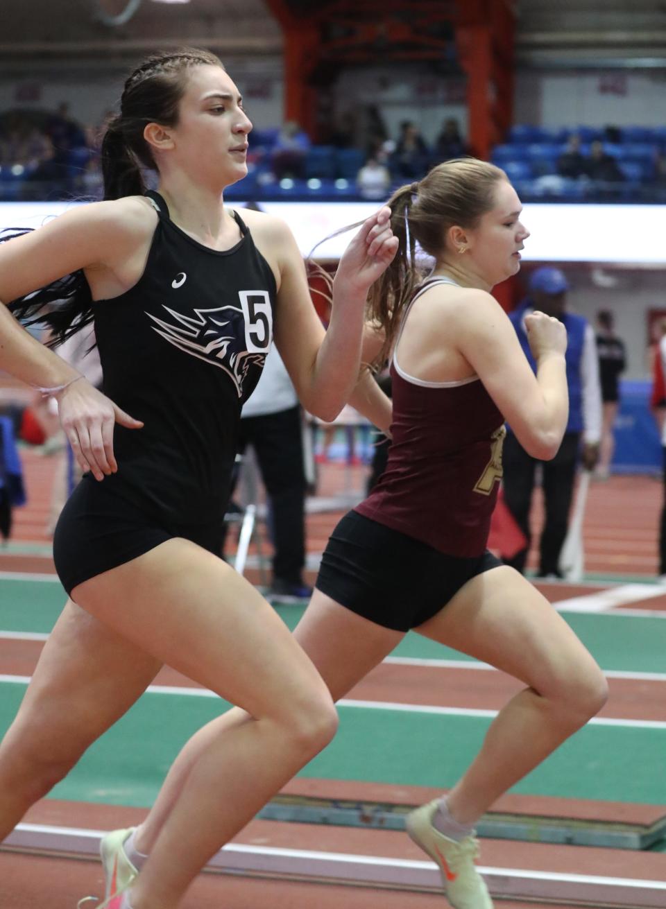 Arlington's Bailey Laguardia, right, won the Northern County 600-meter run and Putnam Valley's Abby Haeusgen was second at the Rockland and Northern Counties track and field championships at the Armory Jan. 26, 2024.