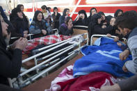 <p>In this photo provided by Tasnim News Agency, relatives weep over the bodies of earthquake victims, in Sarpol-e-Zahab, in western Iran, Nov. 13, 2017. (Photo: Farzad Menati/Tasnim News Agency via AP) </p>