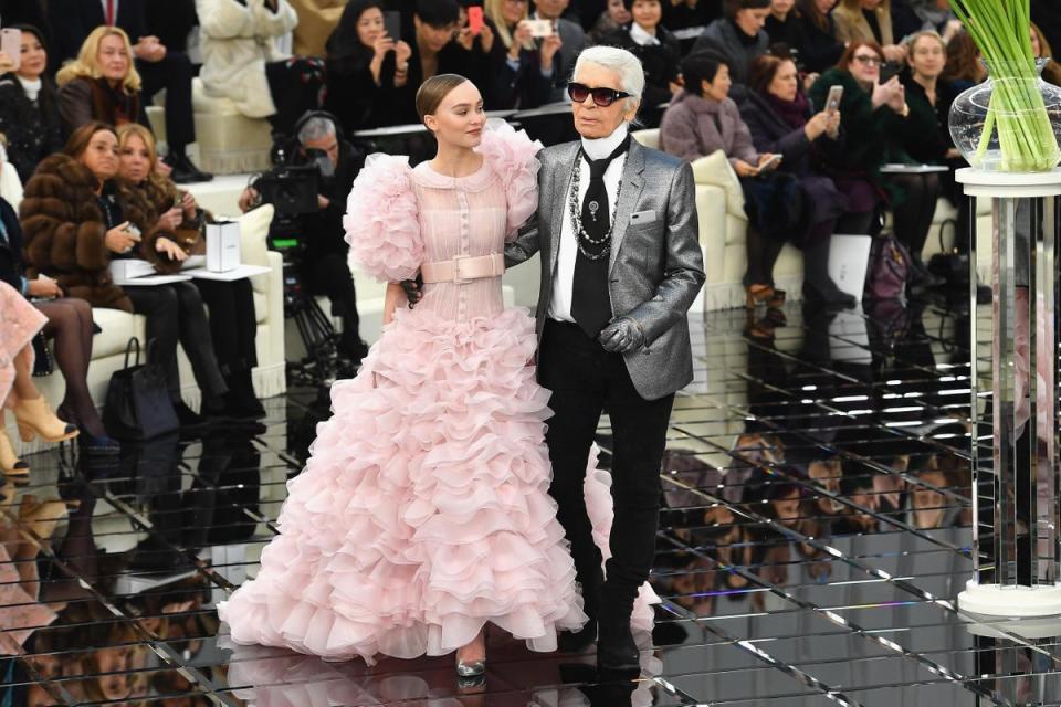 Lily-Rose Depp and Karl Lagerfeld walk the runway during the Chanel Spring Summer 2017 show as part of Paris Fashion Week in 2017 (Getty Images)