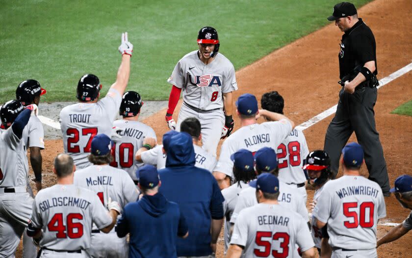 MIAMI, FLORIDA - MARCH 18: Trea Turner #8 of Team USA hits a grand slam in the top of the 8th inning.