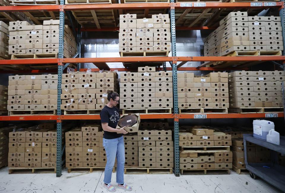Katie Schall looks at the aged cheese at Beehive Cheese, a second generation family-owned business, in Uintah, Weber County, on Tuesday, May 2, 2023. | Jeffrey D. Allred, Deseret News