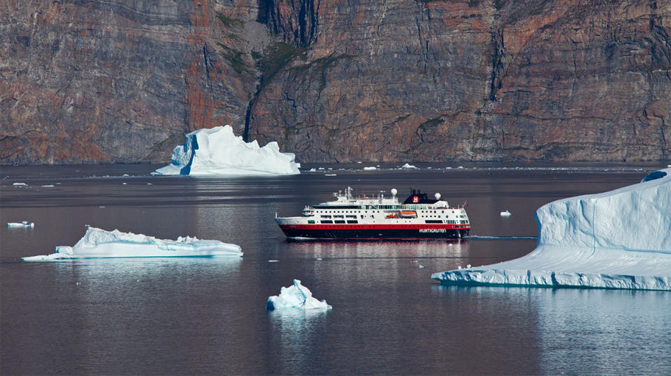 Cruise ship among icebergs in the Uummannaq fjord