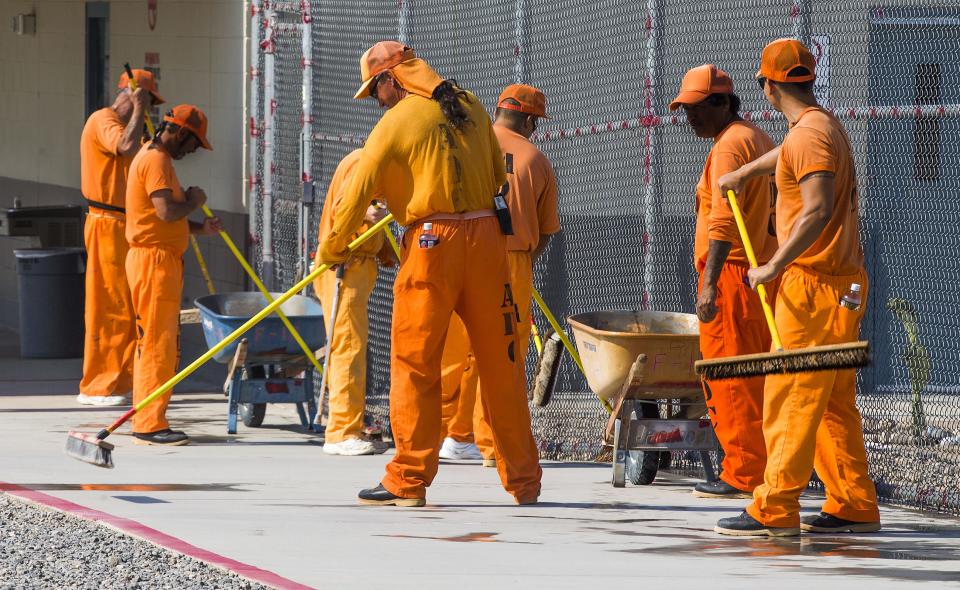 Inmates work inside the prison.