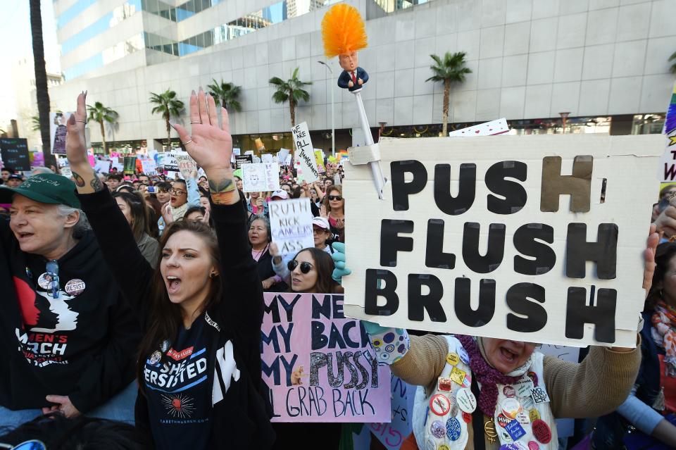 Protesters hold signs during the Women’s March on Jan. 19, 2019 in Los Angeles, Calif. (Photo: Robyn Beck/AFP/Getty Images)