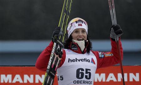 Norway's Marit Bjoergen reacts after winning in the women's cross country Tour de Ski 3 km free individual competition in the eastern German ski resort of Oberhof, December 28, 2013. REUTERS/Tobias Schwarz