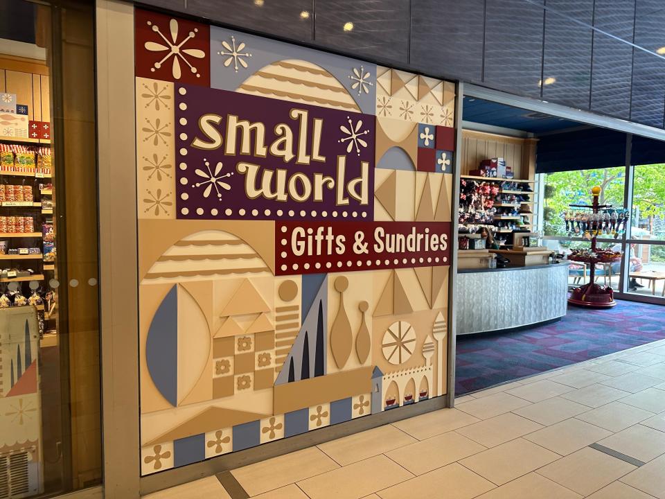 entrance to small world gift shop inside disneyland hotel