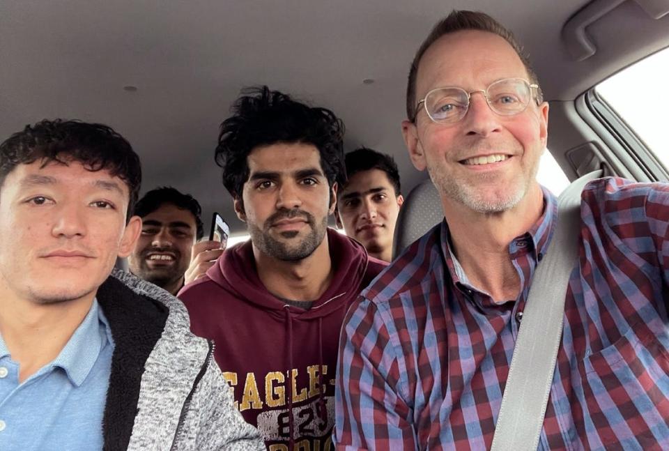 In February, Mike Ruminski drove four Afghan evacuees, who live in the same Green Bay duplex, after a Job Center of Wisconsin event. Ruminski teasingly calls the four mates “The Beatles.” Pictured from left are: Ali Akbar Gholami, Muddassir Saboory, Ahmad Samim Samimi and Fayaz Nabizada.