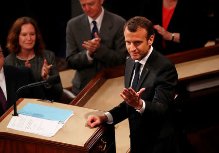 French President Emmanuel Macron reacts to the cheers of attendee as he concludes his address to a joint meeting of the U.S. Congress in the House chamber of the U.S. Capitol in Washington, U.S., April 25, 2018. REUTERS/Jonathan Ernst