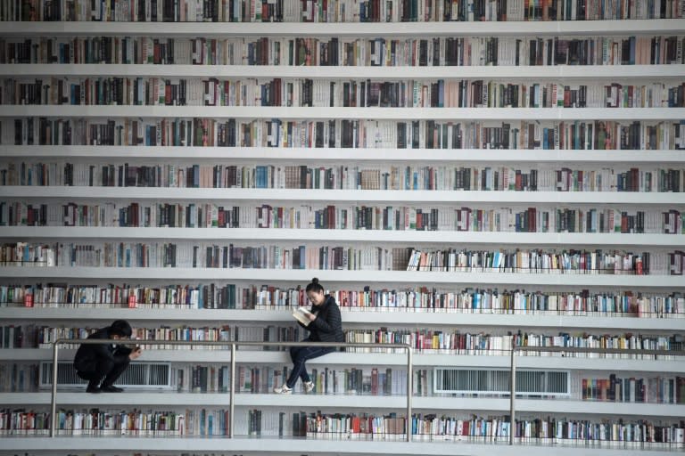 A woman reading a book at the Tianjin Binhai Library