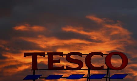 A company logo is pictured outside a Tesco supermarket in Altrincham northern England, April 16, 2016. REUTERS/Phil Noble/Files