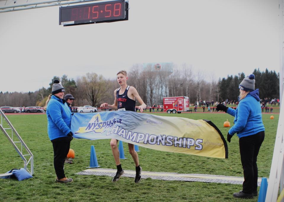 Tri-Valley's Van Furman hits the finishing tape to win the boys Class D state cross-country championship Nov. 11, 2023 in Vernona, New York.