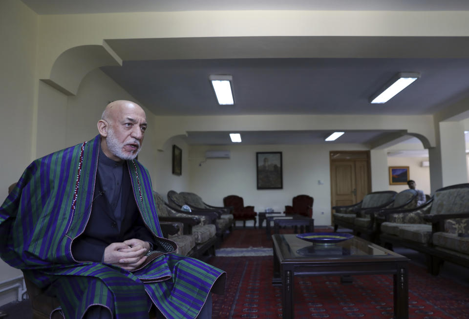 Former Afghan President Hamid Karzai speaks during an interview with the Associated Press at his house, in Kabul, Afghanistan, Sunday, June 20, 2021. Karzai said Sunday the United States came to Afghanistan to fight extremism and bring stability to his war-tortured nation and is leaving nearly 20 years later having failed at both. (AP Photo/Rahmat Gul)