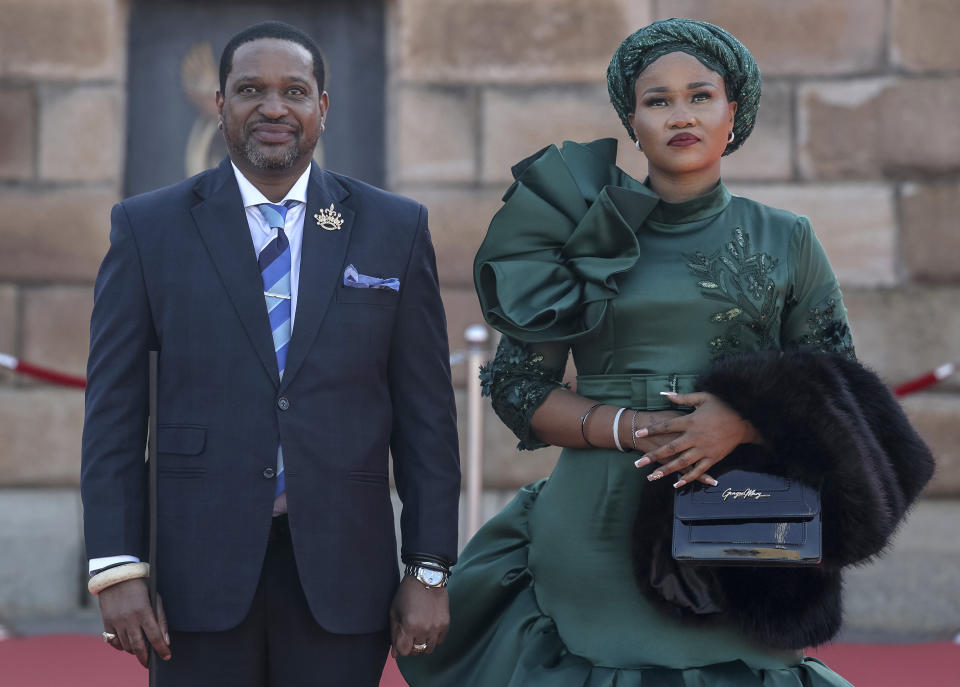 Zulu King Misuzulu kaZwelithini, left, and his third wife Nomzamo Masesi Myeni, right, arrive ahead of the inauguration of South Africa's Cyril Ramaphosa as President at the Union Buildings in Tshwane, South Africa, Wednesday, June 19, 2024. (Phill Magakoe/Pool Photo via AP)
