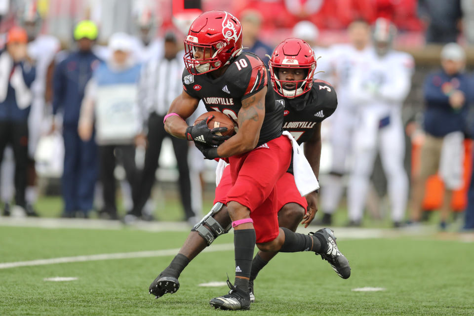 LOUISVILLE, KY - OCTOBER 26: Louisville Cardinals running back Javian Hawkins (10) takes a handoff from Louisville Cardinals quarterback Micale Cunningham (3) during the first quarter of the college football game between the Virginia Cavaliers and Louisville Cardinals on October 26, 2019, at Cardinal Stadium in Louisville, KY. (Photo by Frank Jansky/Icon Sportswire via Getty Images)