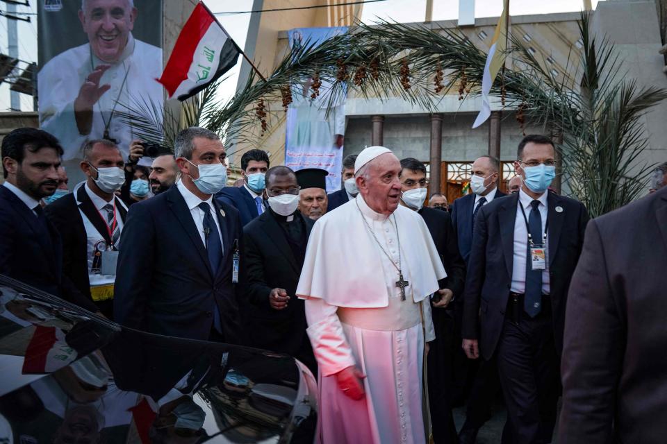 Security surround Pope Francis as he leaves the cathedralAFP via Getty Images