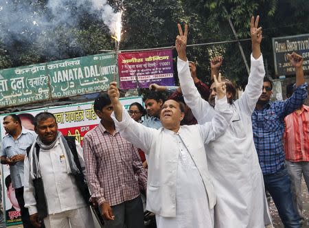 Supporters of Janata Dal (United) celebrate after learning the initial results outside the party office in New Delhi, India, November 8, 2015. REUTERS/Anindito Mukherjee